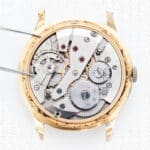 black and white close view of watch mechanism