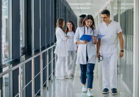 team-of-young-specialist-doctors-standing-in-the-corridor-of-the-hospital-scaled-e1662545863938-aspect-ratio-535-375